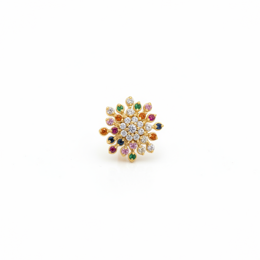 Multicolored gemstone ring on a hand with a red fabric background