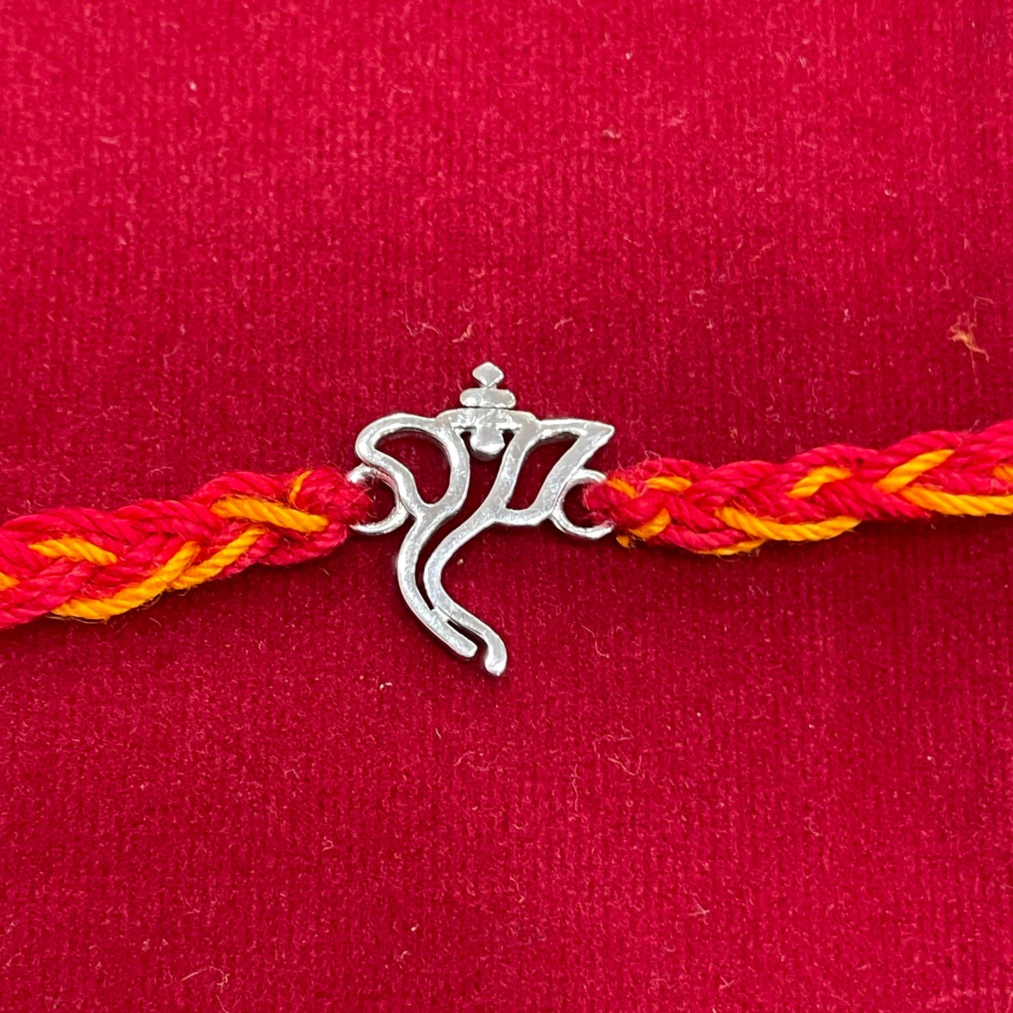 925 Sterling Silver Ganesha Face Rakhi | Red & Yellow Thread Rakhi for Raksha Bandhan