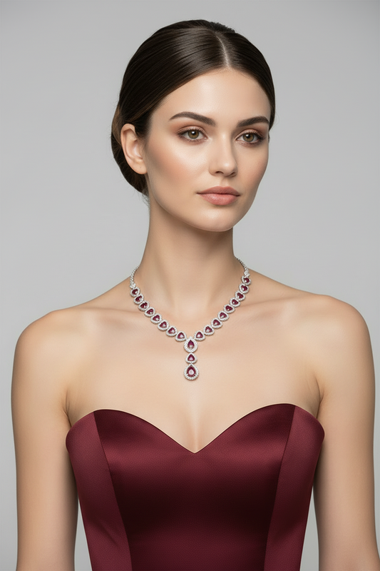 Woman wearing a luxurious necklace with a gray background