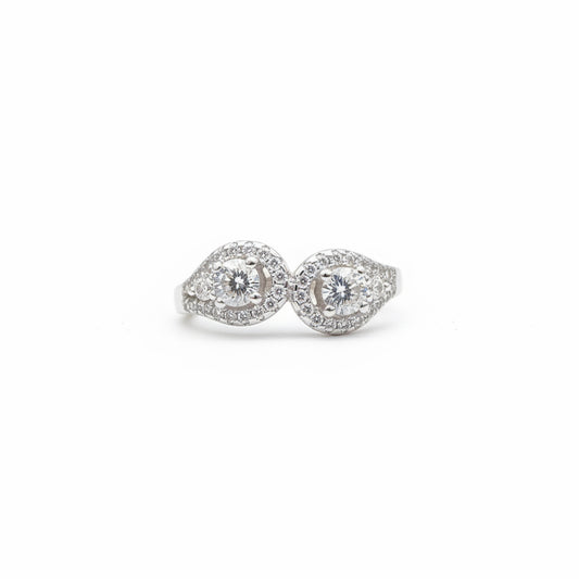 Pair of pink diamond earrings on a blue cushion