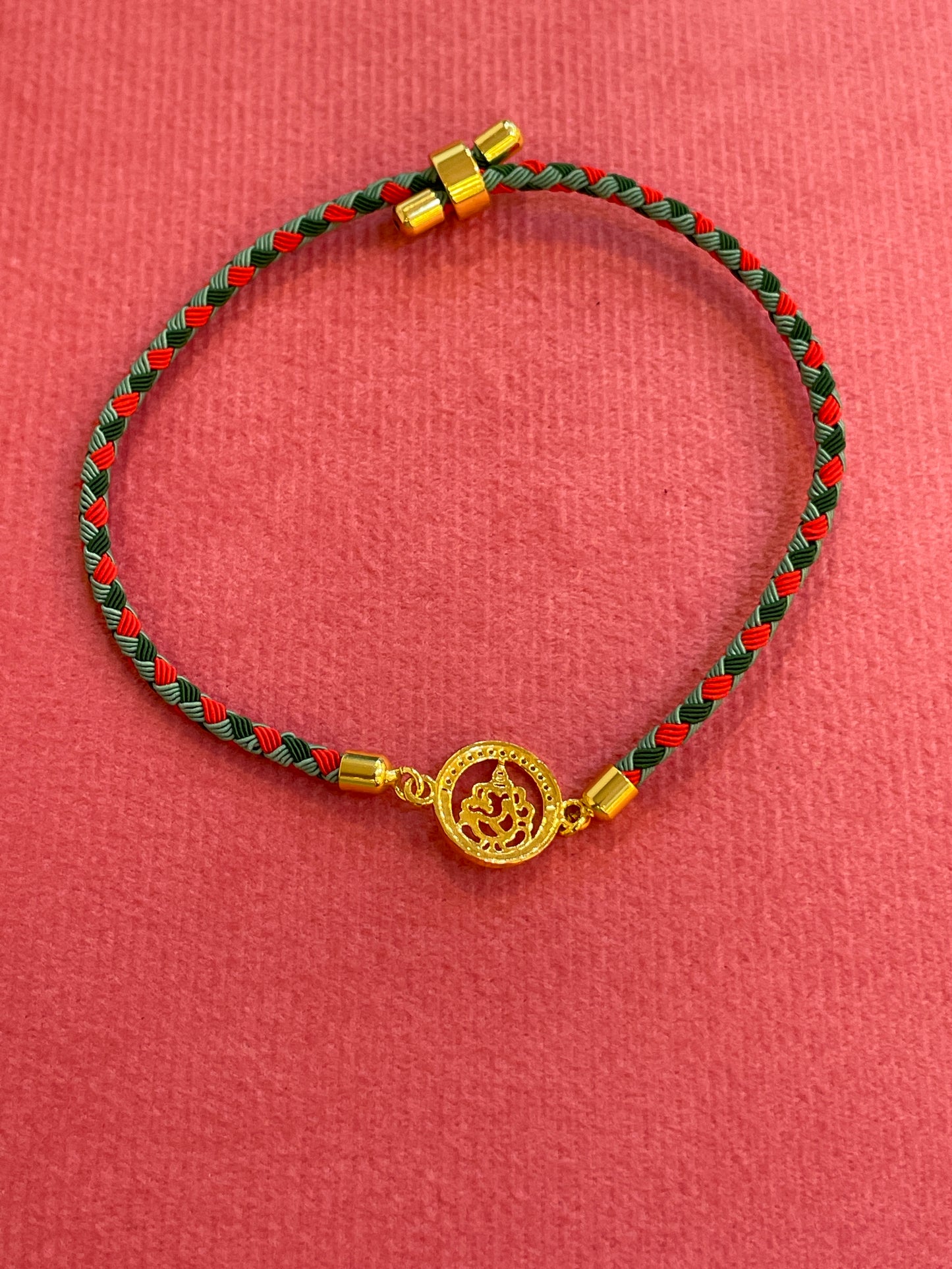 Silver Ganesha Rakhi for Brother | Gold Plated Ganesh Coin Charm on Red & Green Braided Thread