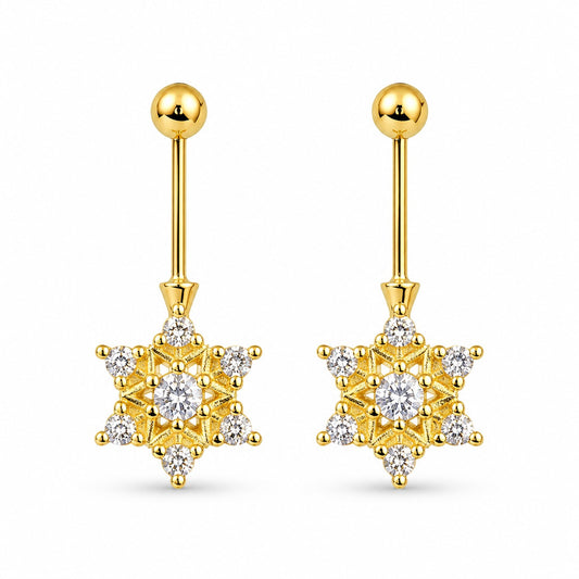 Gold star-shaped bugadi
earrings with clear gemstones on a white background