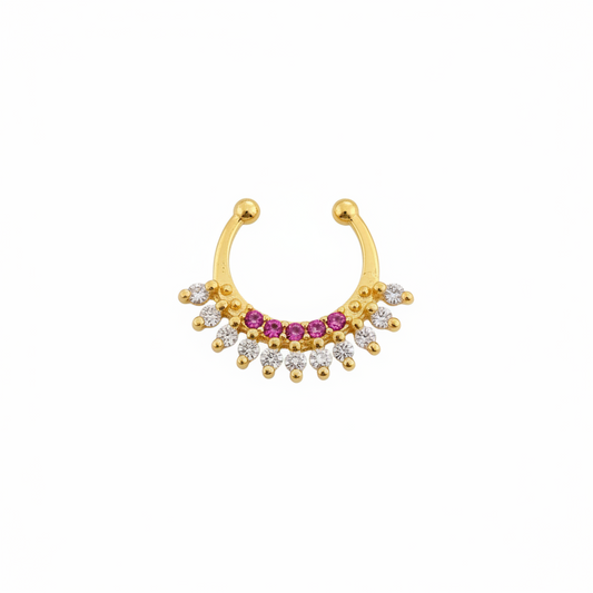 Gold nose ring with gemstones on a teal fabric background