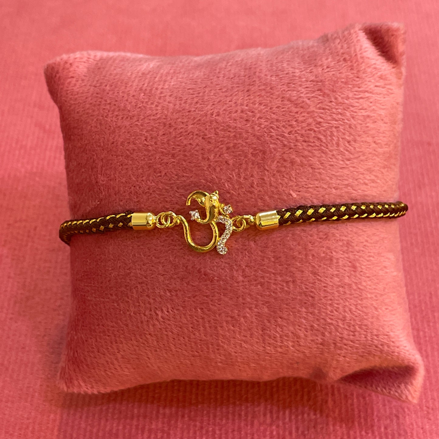 Silver Om Rakhi for Brother | Gold Plated Om Clasp on Brown & Gold Braided Thread