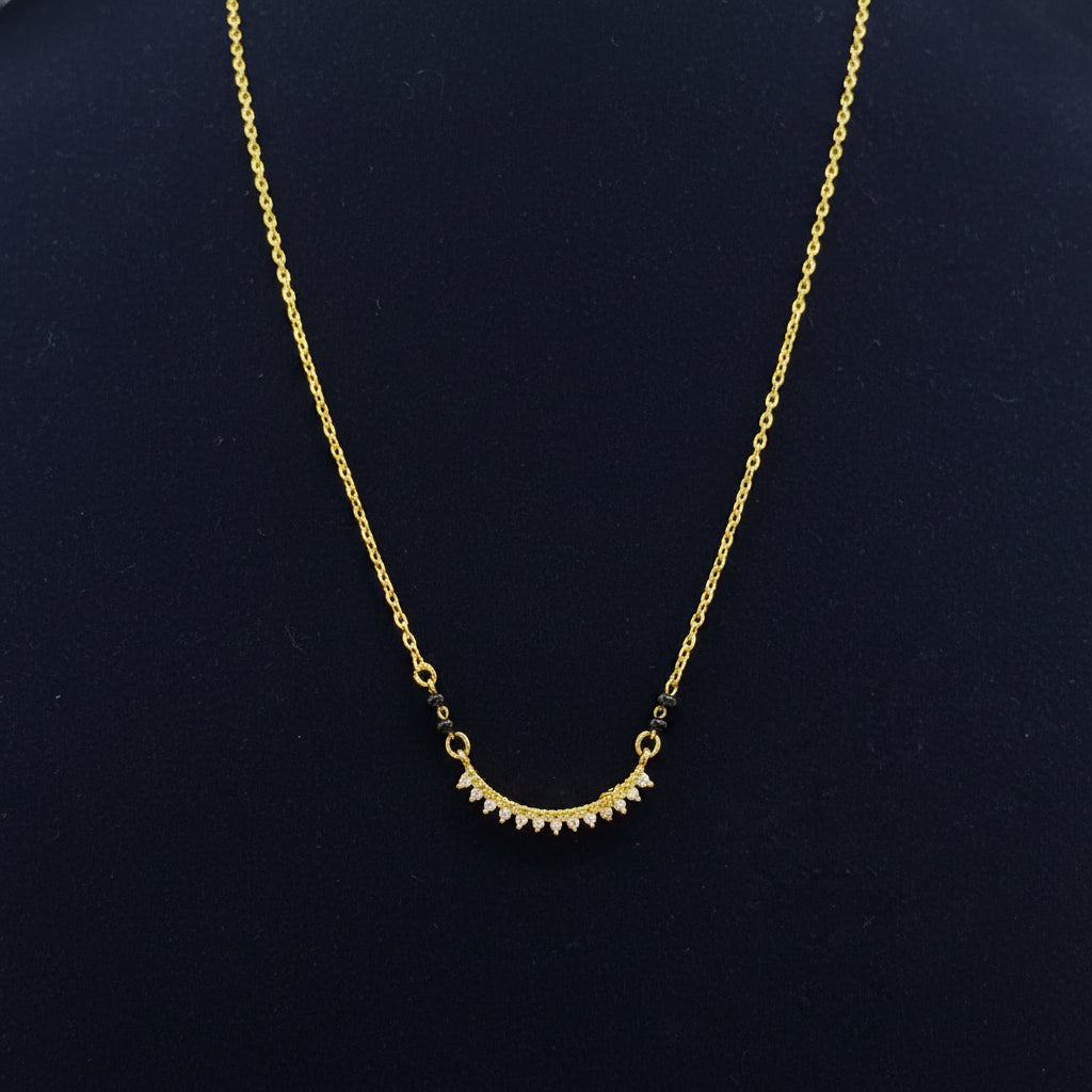 Gold necklace on a red fabric background