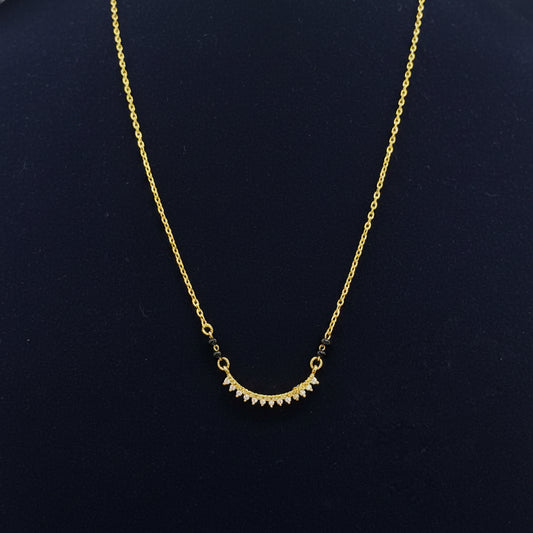 Gold necklace on a red fabric background