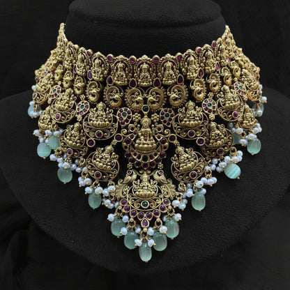 Decorative gold and pearl headpiece on a pink fabric background