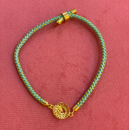 Silver Om Rakhi for Brother | Gold Plated CZ Charm with Teal Thread