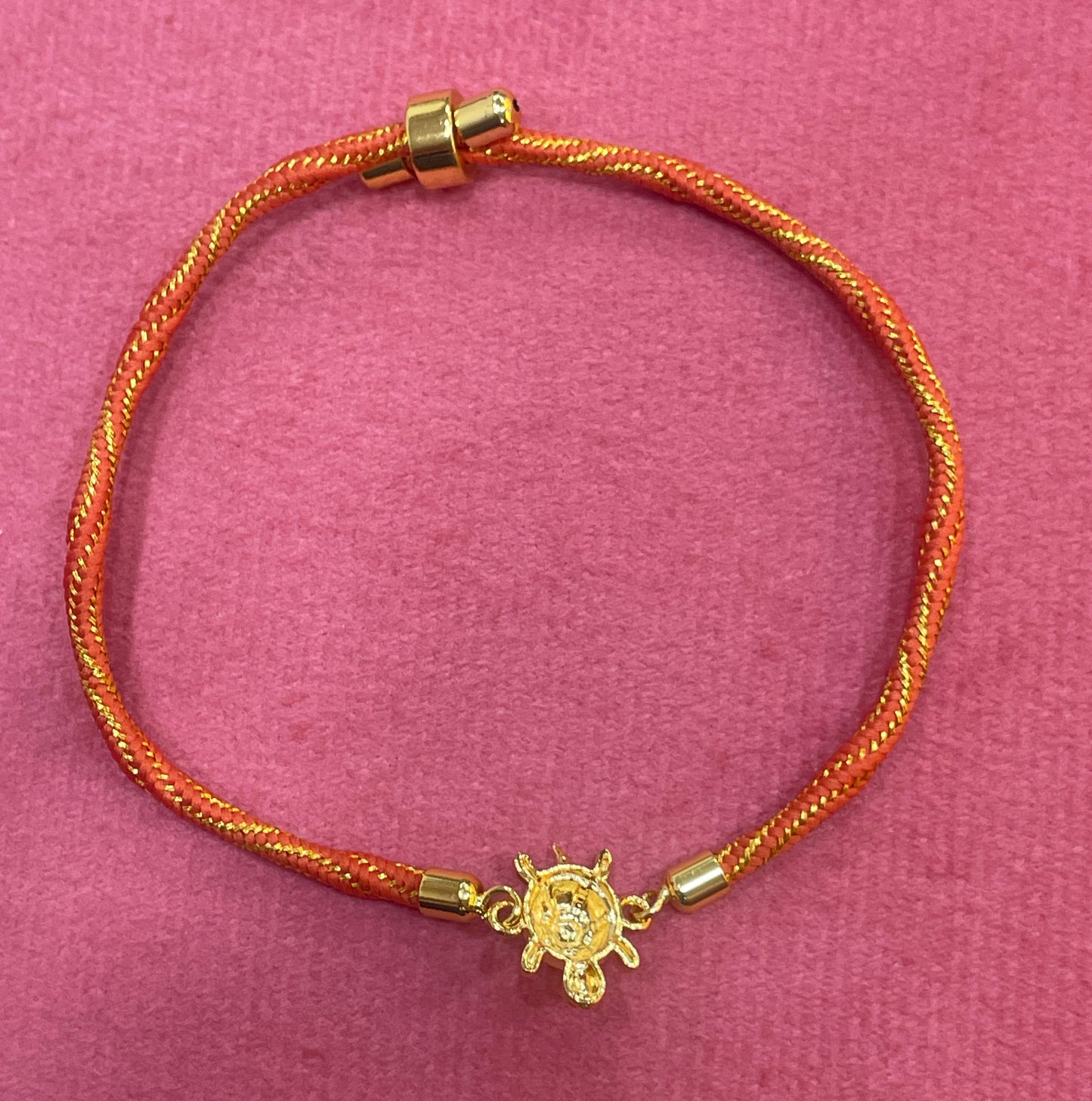 Gold-Plated Rakhi for Brother | Lucky Tortoise Charm on Orange Silk Thread