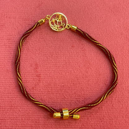 Gold Plated Ganesha Rakhi for Brother | Circular Cutwork Motif with Maroon Thread