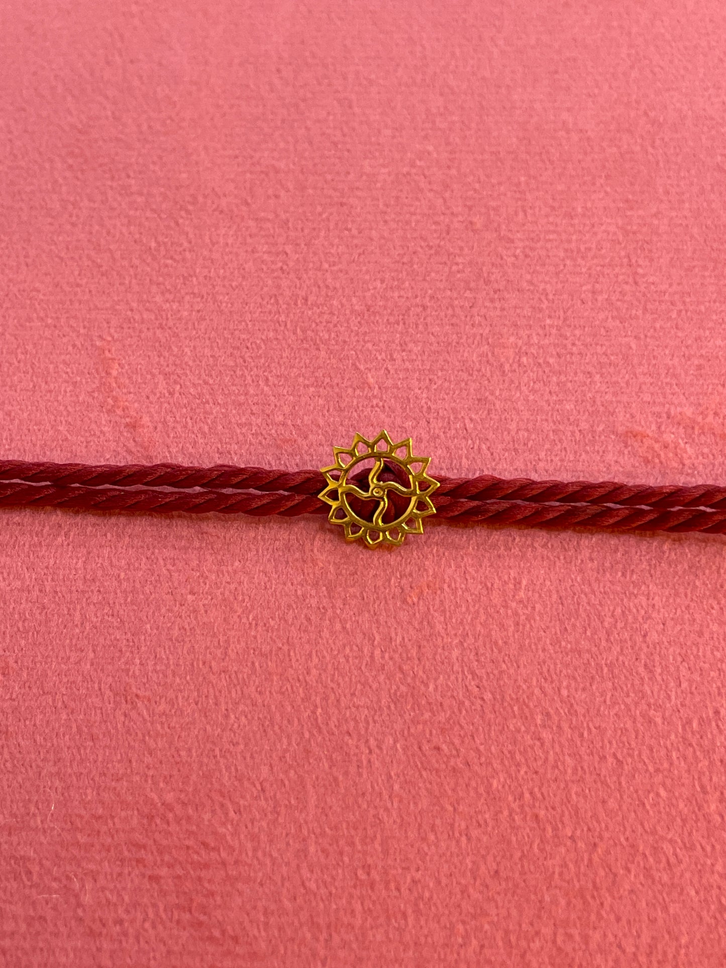 Gold Plated Swastik Rakhi for Brother | Silver Charm with Maroon Thread