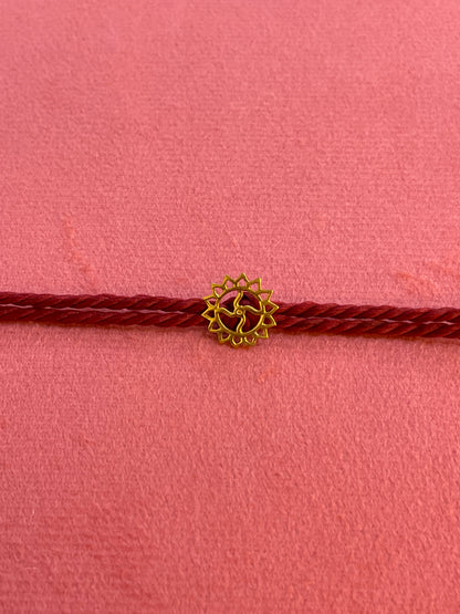 Gold Plated Swastik Rakhi for Brother | Silver Charm with Maroon Thread