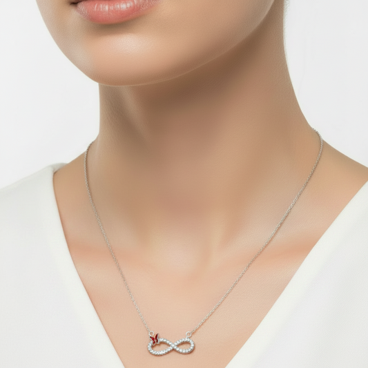 Necklace with a heart and key pendant in a black jewelry box on a red background