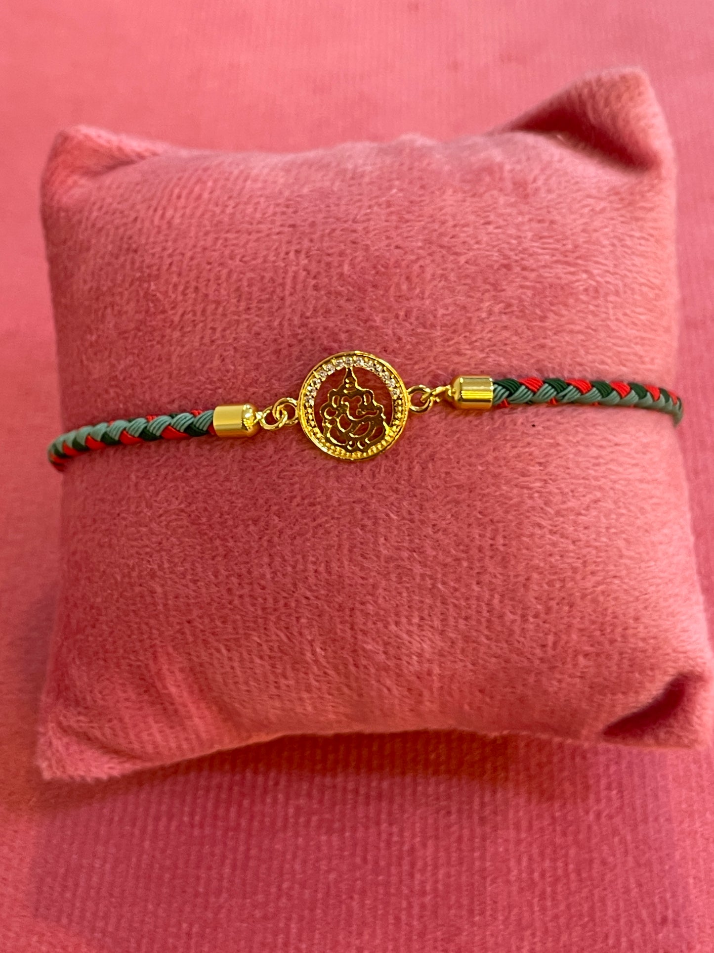 Silver Ganesha Rakhi for Brother | Gold Plated Ganesh Coin Charm on Red & Green Braided Thread