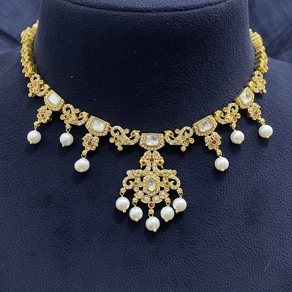 Gold and pearl jewelry set on a red fabric background