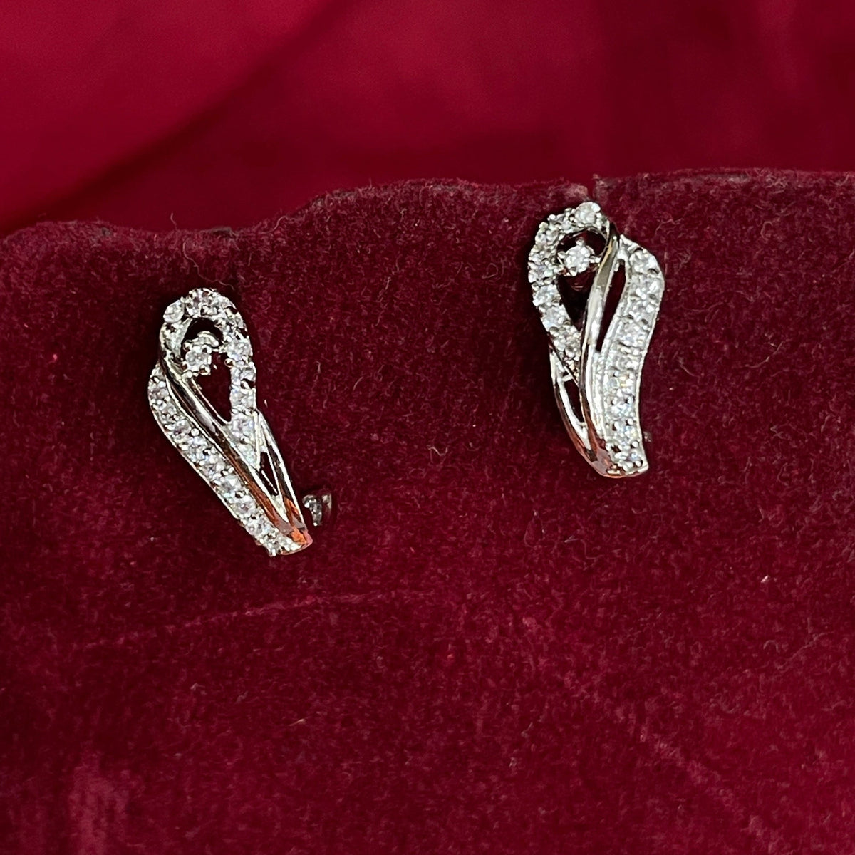 92.5 Sterling Silver CZ Sweeping Loop Teardrop J Studs pair