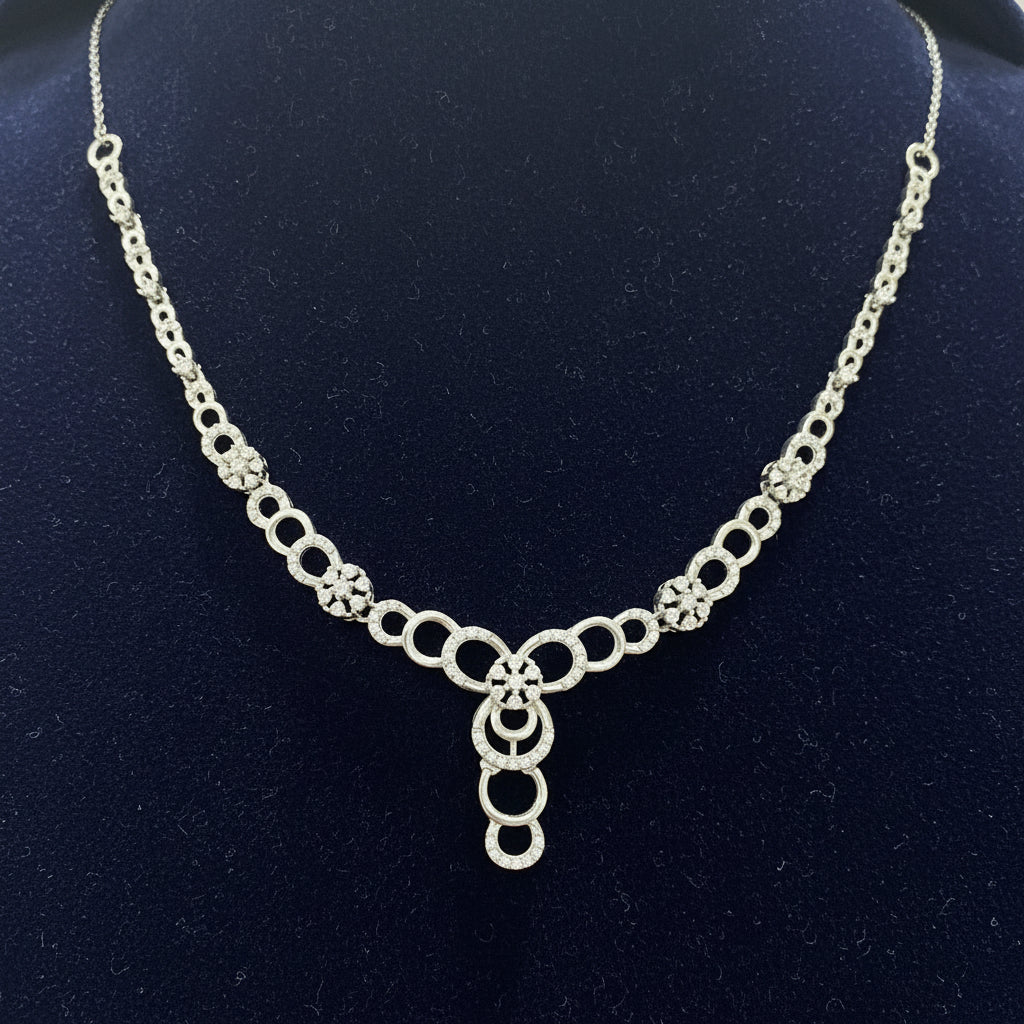 Silver chain bracelet on a red fabric background