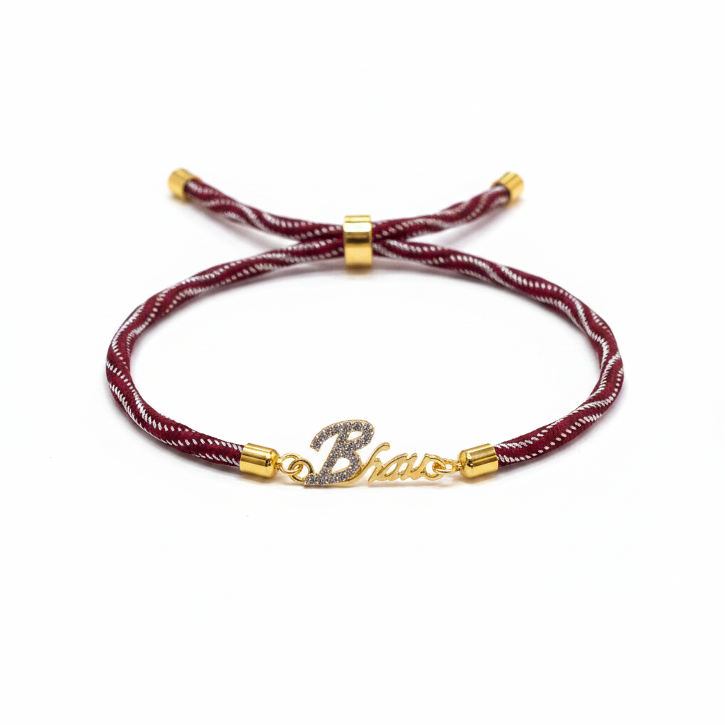 Gold-Plated Bhaiya Name Rakhi for Brother | CZ Script Charm on Maroon & Gold Twisted Thread