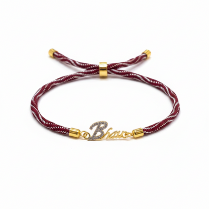 Gold-Plated Bhaiya Name Rakhi for Brother | CZ Script Charm on Maroon & Gold Twisted Thread