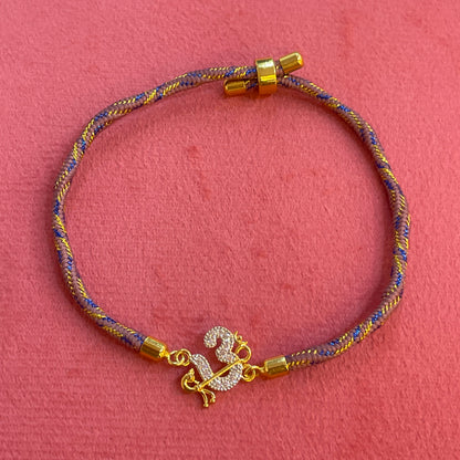 925 Silver Om Rakhi for Brother | Gold Plated CZ Om Charm on Grey Blue Thread