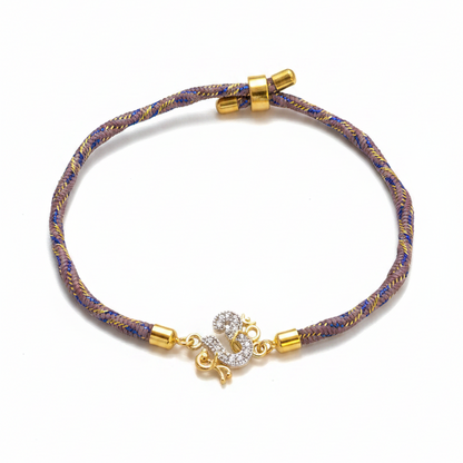 925 Silver Om Rakhi for Brother | Gold Plated CZ Om Charm on Grey Blue Thread