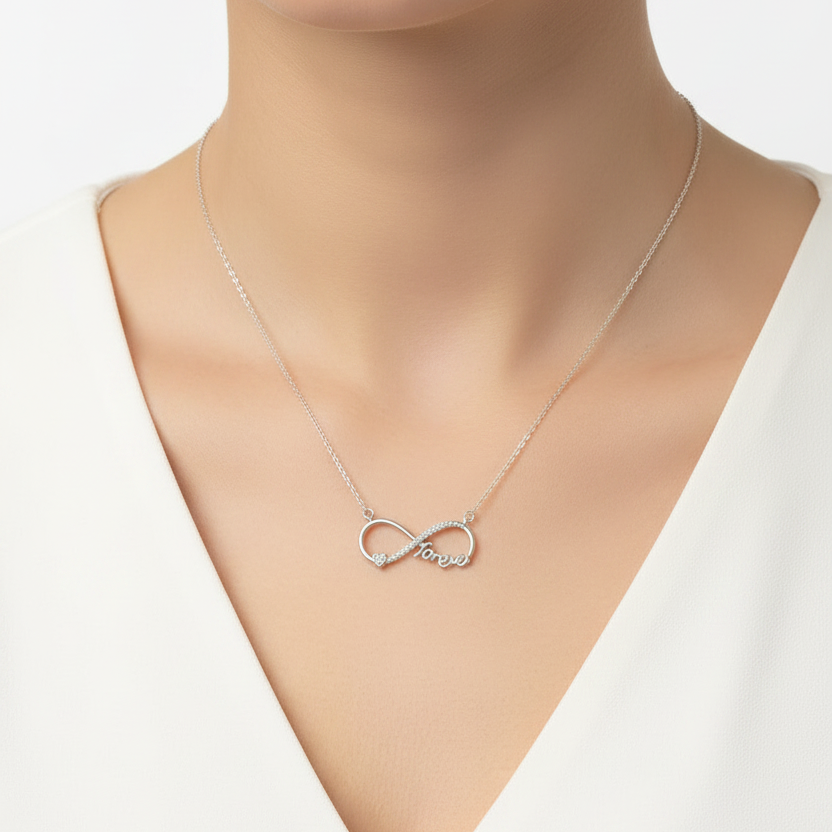 Silver necklace in a black jewelry box on a red fabric background