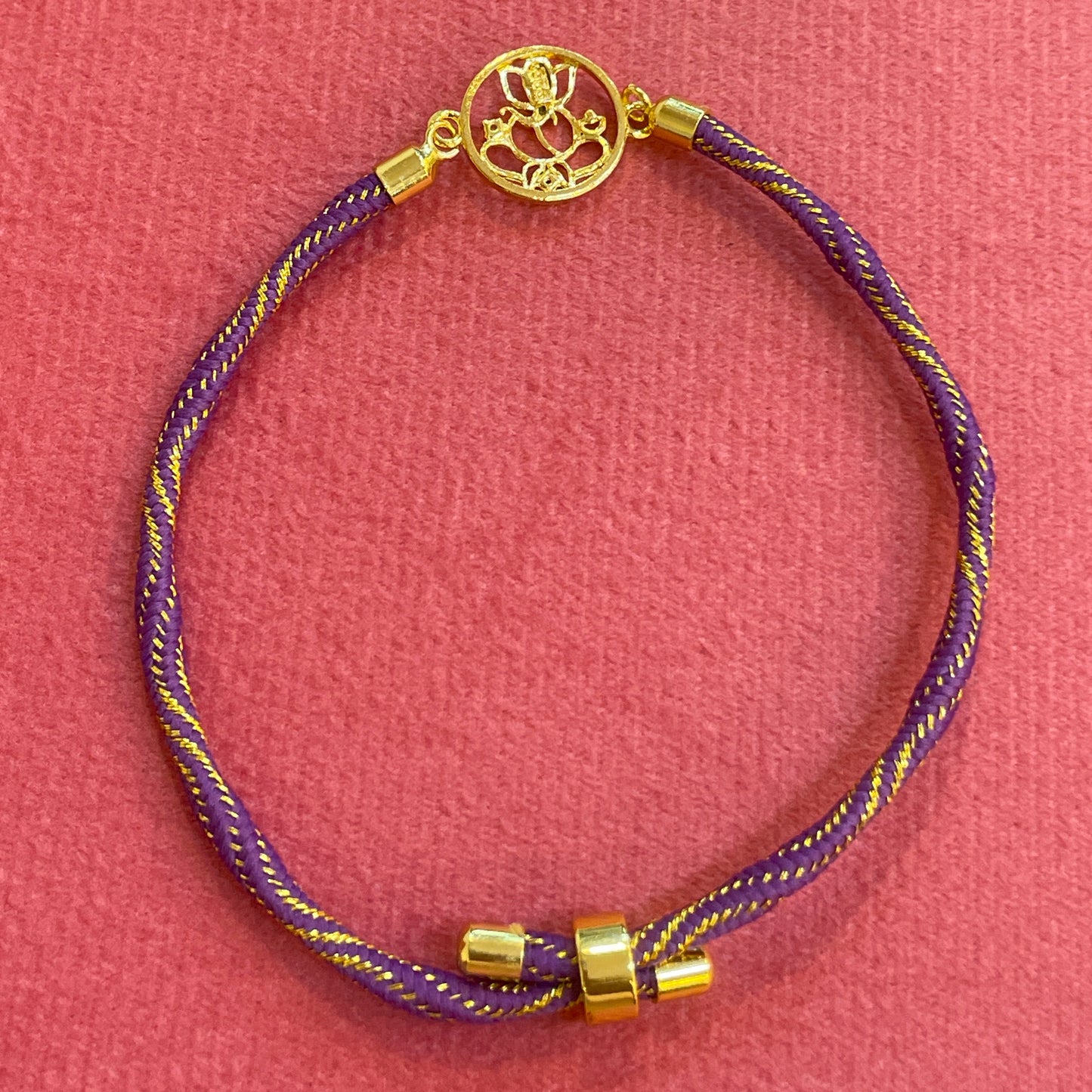 Silver Ganesha Rakhi for Brother | Gold Plated Open Frame Ganesh Charm on Purple & Gold Thread