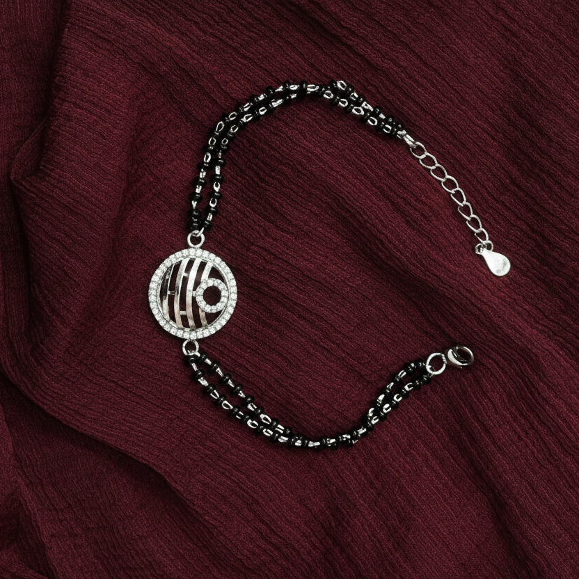 Bracelet with a decorative charm on a red fabric background