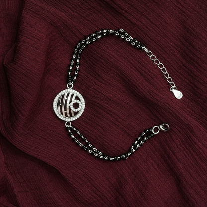Bracelet with a decorative charm on a red fabric background