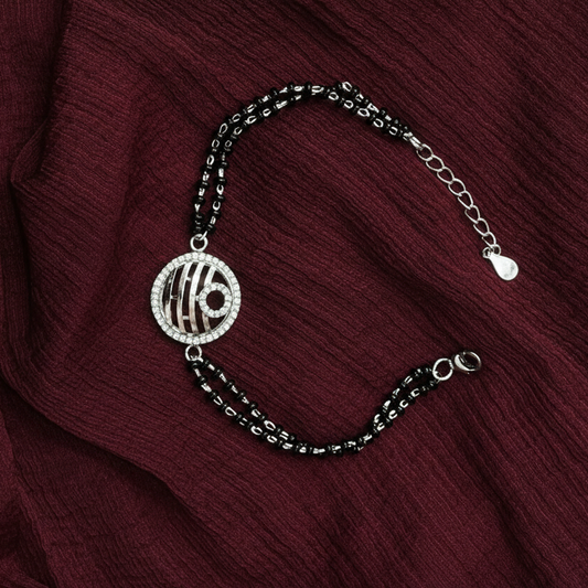 Bracelet with a decorative charm on a red fabric background