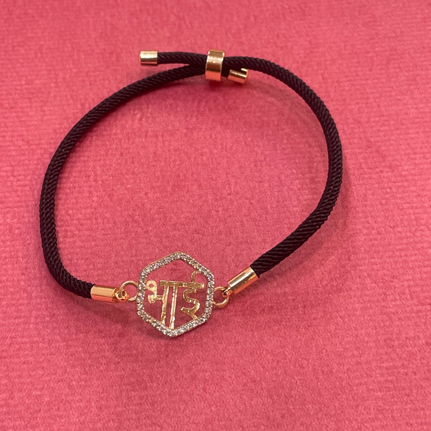 Rose Gold-Plated Rakhi for Brother | CZ Hexagon Bhai Script Charm on Black Silk Thread