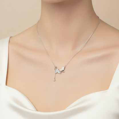 Necklace with a butterfly pendant in a black box on a red fabric background