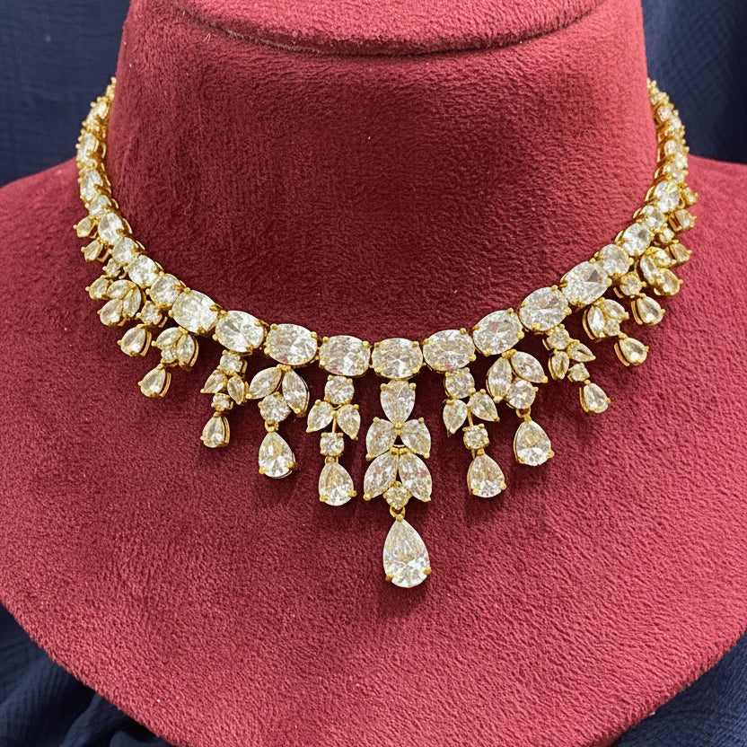 Gold and diamond bracelet on a red cushion