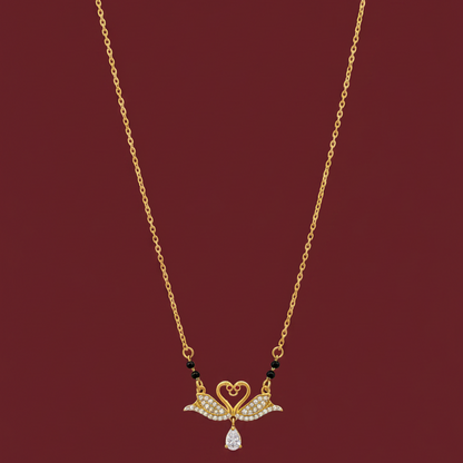 Gold necklace with a decorative pendant on a red velvet background