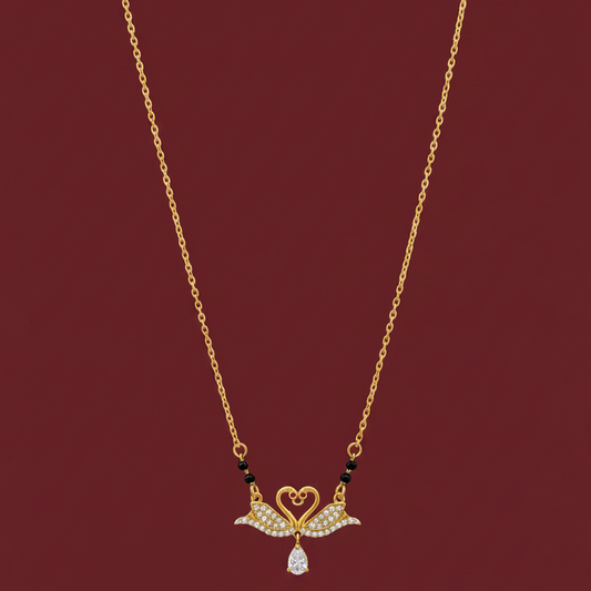 Gold necklace with a decorative pendant on a red velvet background
