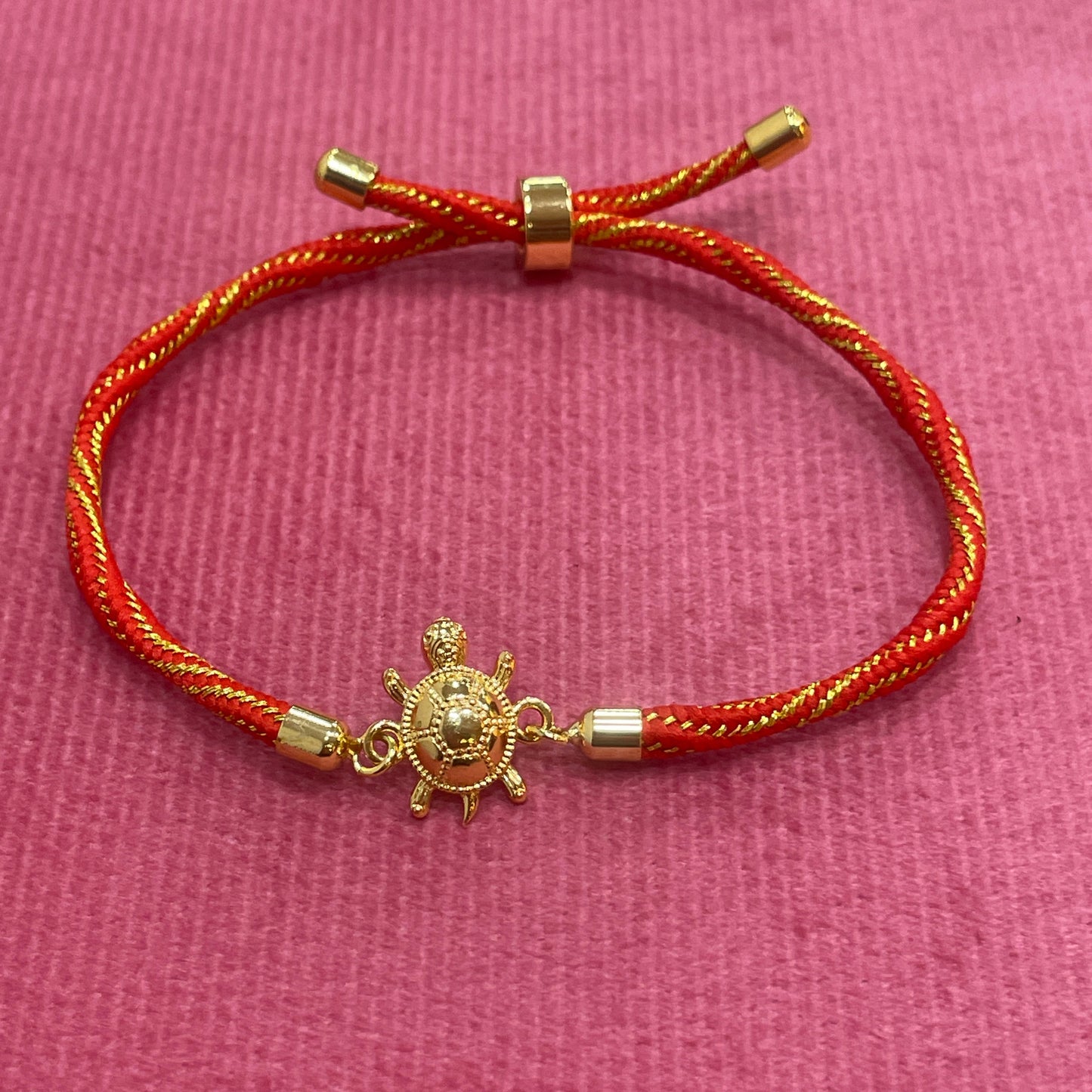Gold-Plated Rakhi for Brother | Lucky Tortoise Charm on Red & Gold Silk Thread
