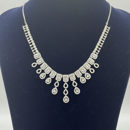 Silver necklace on a red fabric background