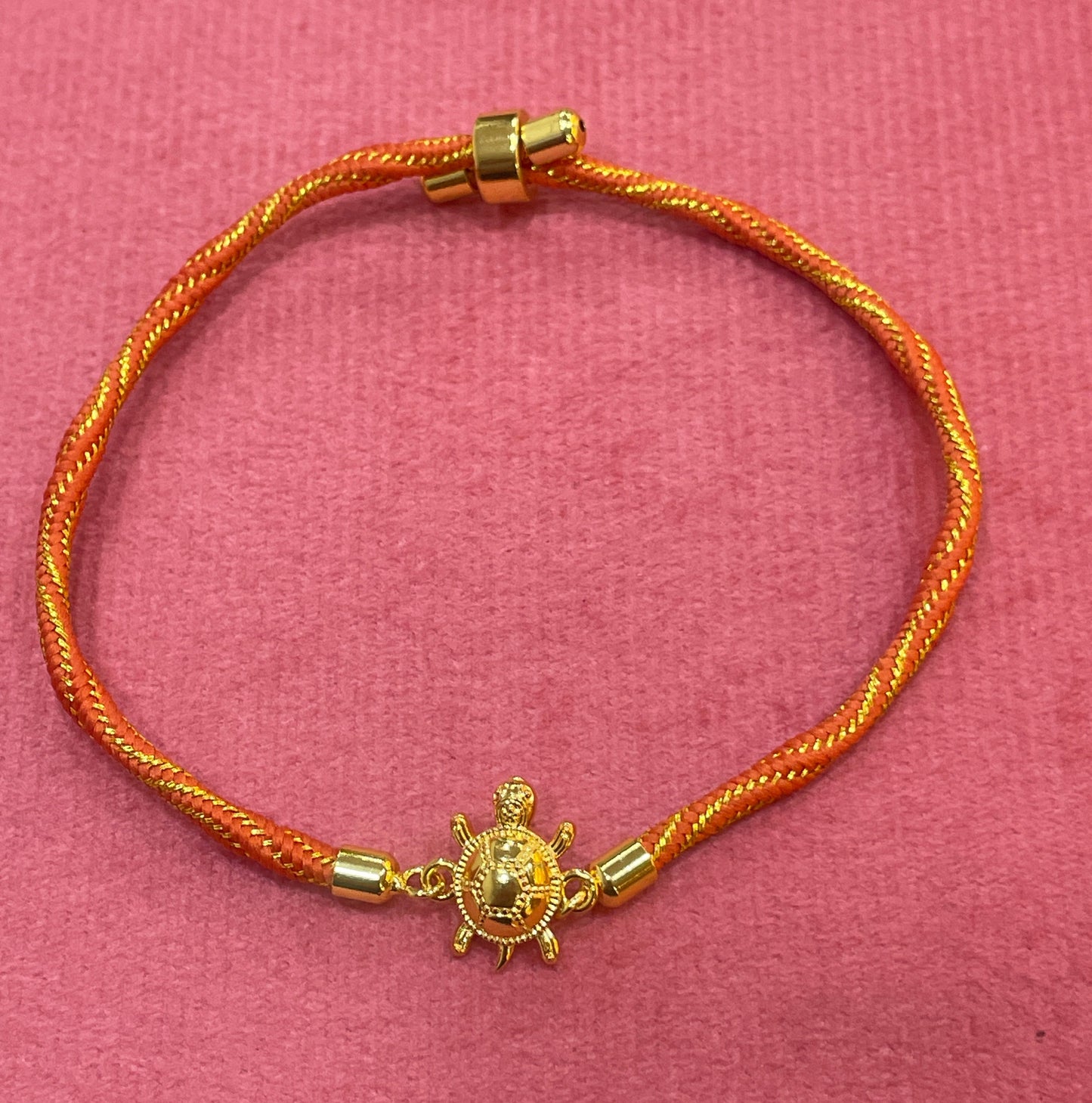 Gold-Plated Rakhi for Brother | Lucky Tortoise Charm on Orange Silk Thread