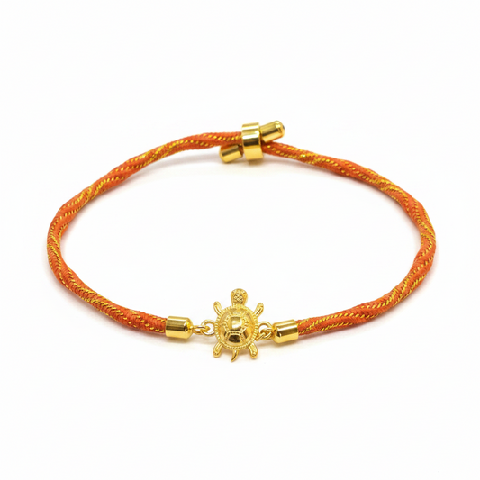 Gold-Plated Rakhi for Brother | Lucky Tortoise Charm on Orange Silk Thread