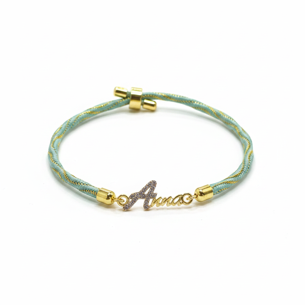 Gold-Plated Name Rakhi for Brother | CZ Script Charm on Teal & Gold Twisted Thread