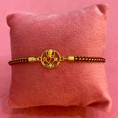 925 Silver Ganesha Rakhi for Brother | Gold Plated Circular Charm on Maroon Thread