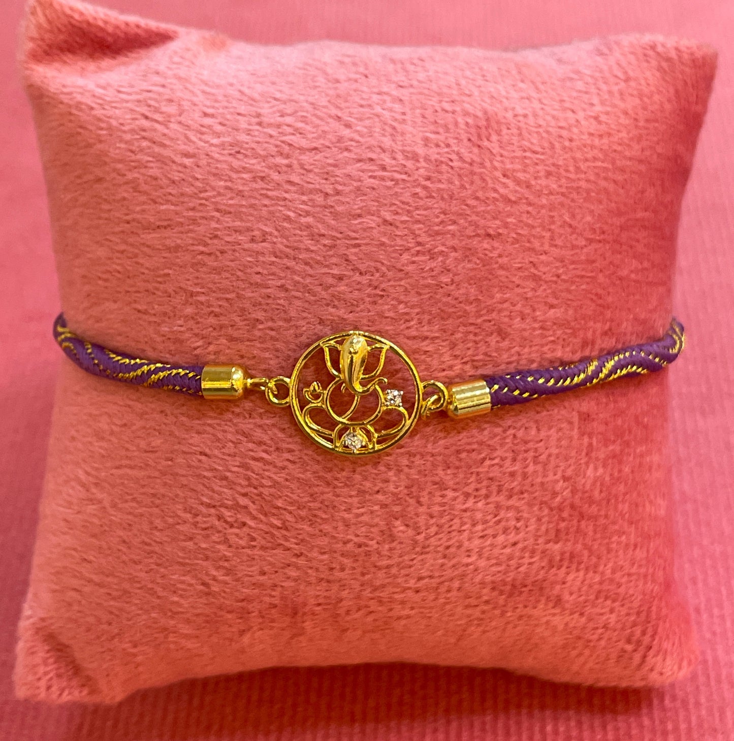 Silver Ganesha Rakhi for Brother | Gold Plated Open Frame Ganesh Charm on Purple & Gold Thread