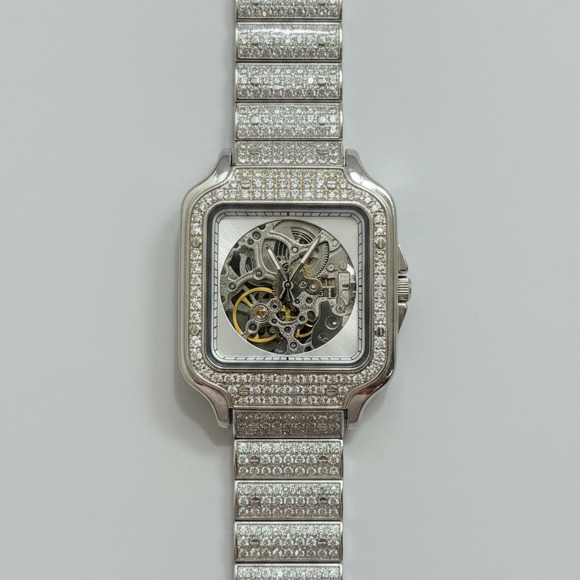 Silver watch with diamond-studded band on a red fabric background