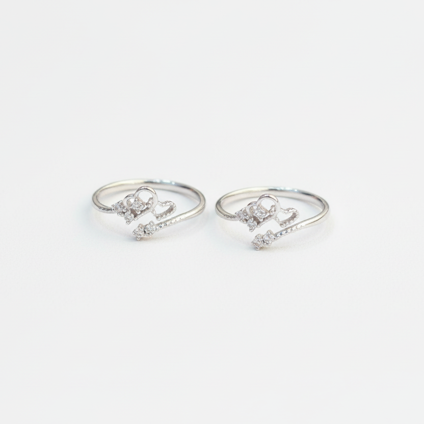 Pair of silver ring-shaped earrings on a white background