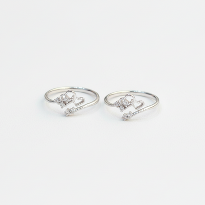 Pair of silver ring-shaped earrings on a white background