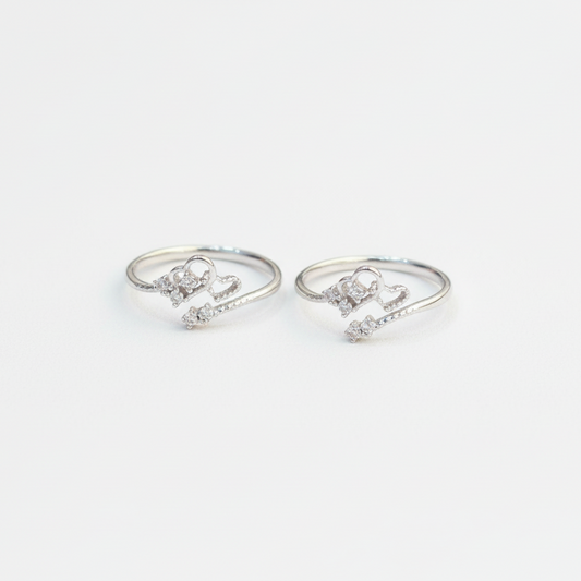 Pair of silver ring-shaped earrings on a white background