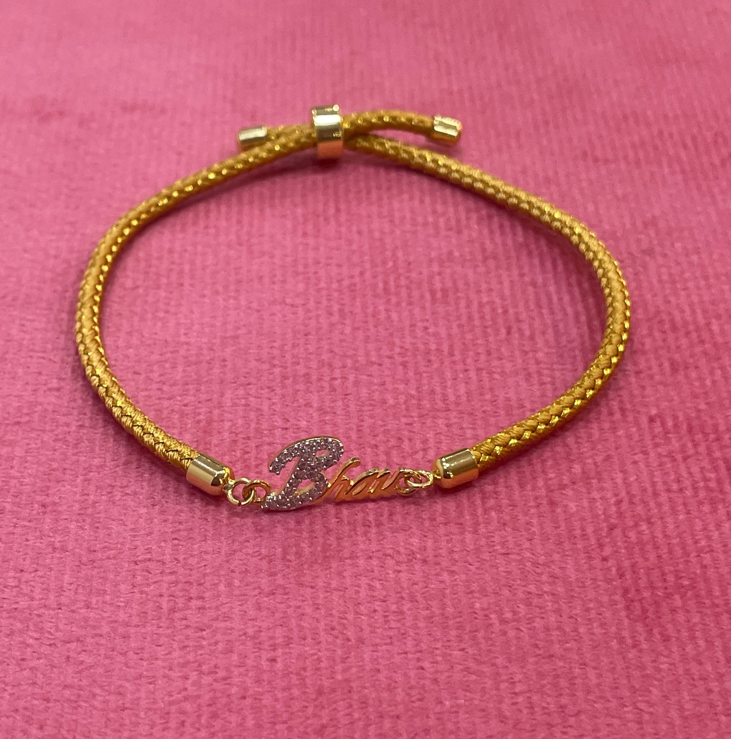 Gold-Plated Bhaiya Name Rakhi for Brother | CZ Script Charm on Gold Thread