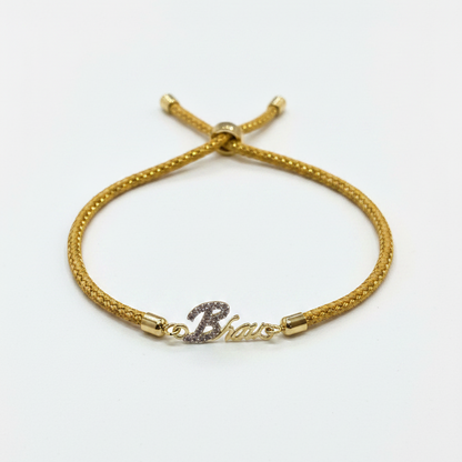 Gold-Plated Bhaiya Name Rakhi for Brother | CZ Script Charm on Gold Thread