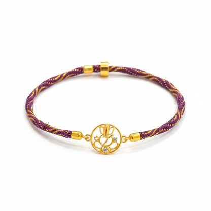 Silver Ganesha Rakhi for Brother | Gold Plated Open Frame Ganesh Charm on Purple & Gold Thread