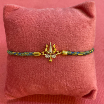 Silver Trishul Rakhi for Brother | Gold Plated Trishul Charm with CZ Stones on Teal Thread